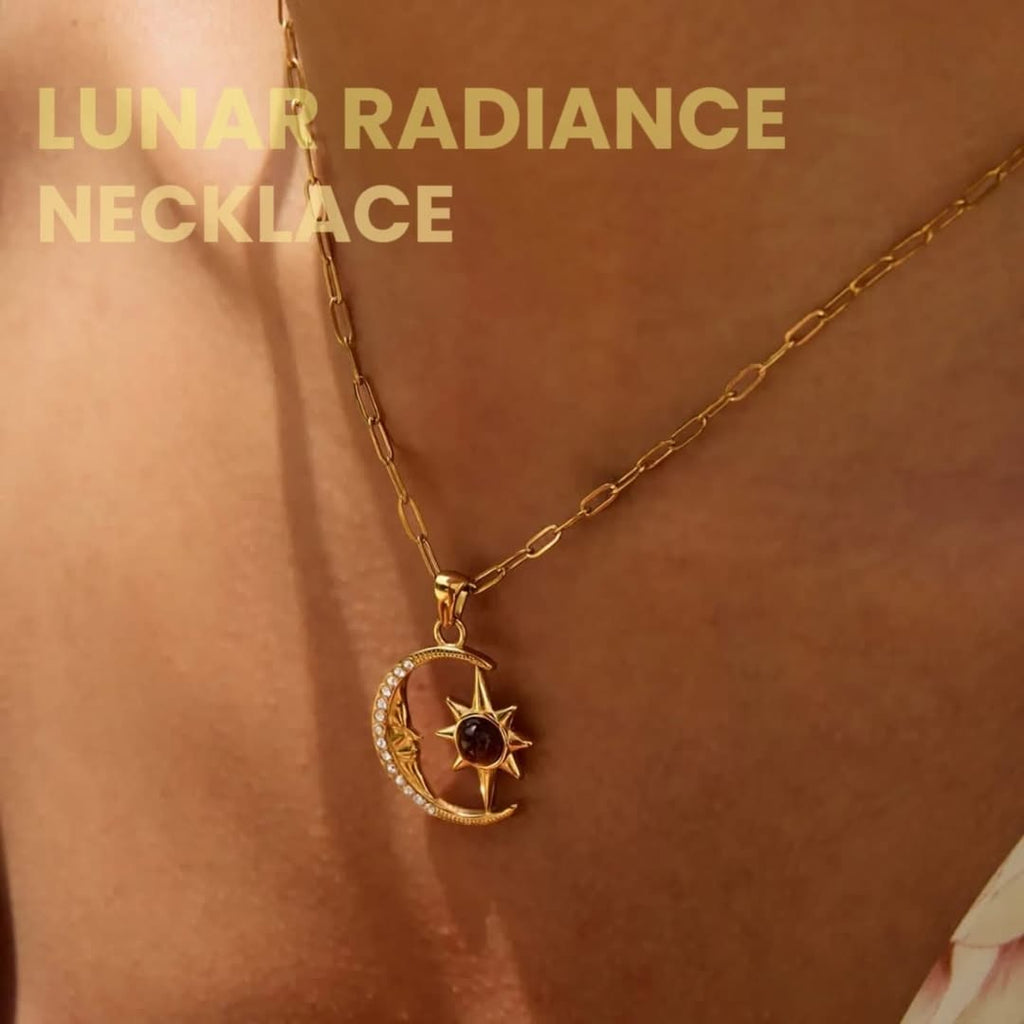 Gold necklace with moon and sun pendant on a person's neck, labeled 'Lunar Radiance Necklace'.